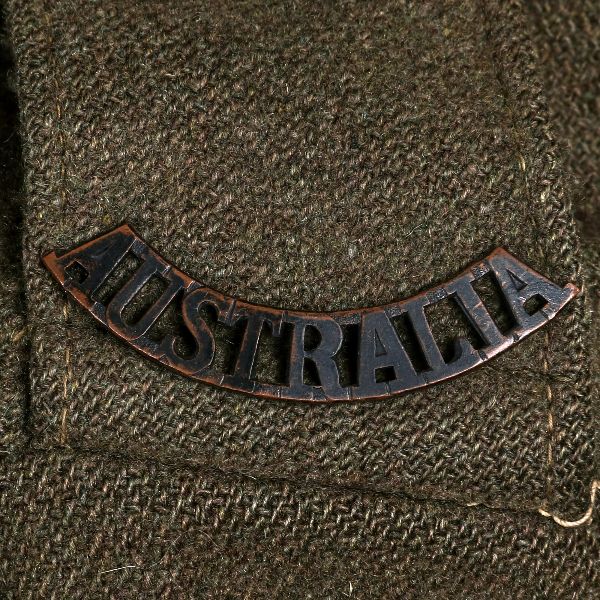 Original WWII Second Australian Imperial Force P-1917 Tunic Dated 1942 with 1945 Dated Wool Greatcoat Both With Insignia - 2 Items